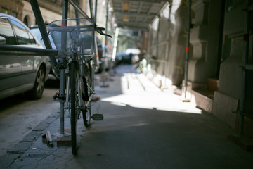 Old vintage walking bike in the city