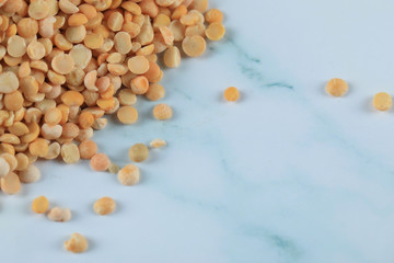 Yellow fresh and healthy beans on blue marble