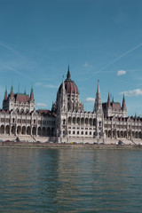 Fototapeta premium Budapest Parliament Building in the afternoon against a clear blue sky
