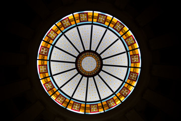 Stained glass window on the ceiling in an old building