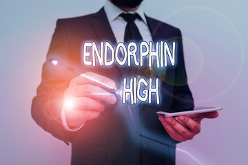 Conceptual hand writing showing Endorphin High. Concept meaning trigger a positive feeling in the...