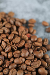 Fresh brown coffee beans on the bottom of the background