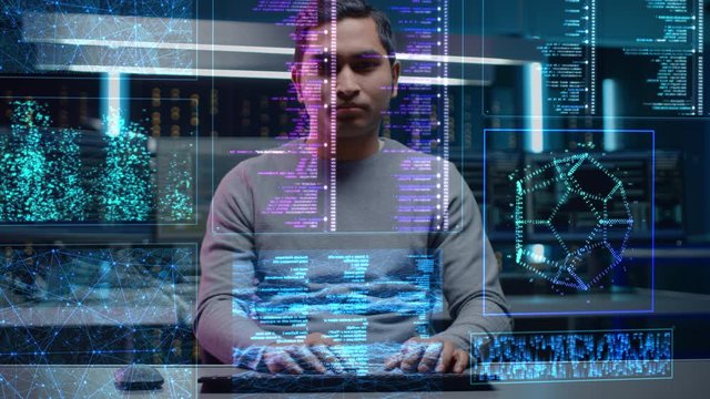 Software Programmer Working on Computer with Neural Networking, Machine Learning, Big Data, Artificial Intelligence. Coding Language Projection Reflects on His Face. POV Portrait Camera