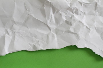 torn paper on green background with copy space for text