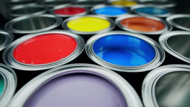 Opened metal can with colors paint top view