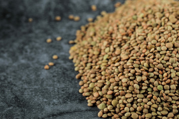Green fresh and healthy lentil on the right side of the background