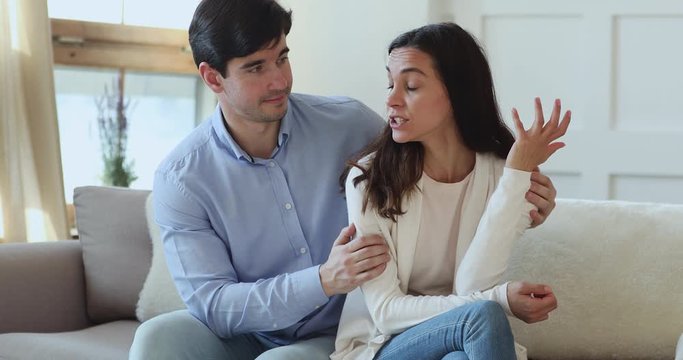 Young husband apologizing upset annoyed wife trying to make peace after fight. Guilty boyfriend asking for forgiveness begging angry girlfriend saying sorry please. Remorse, conflicts, apology concept