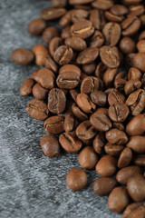 Fresh coffee beans isolated on blue background