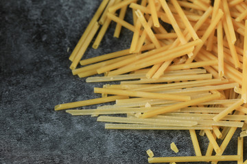 Homemade fresh spaghetti on the right side of the background