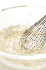 egg beater and pan cake dough for baking image