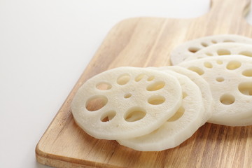 freshness lotus roots sliced on wooden board with copy space