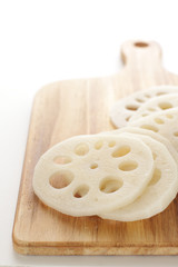 freshness lotus roots sliced on wooden board with copy space