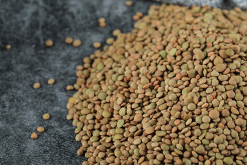 Green fresh and healthy lentil on the right side of the background