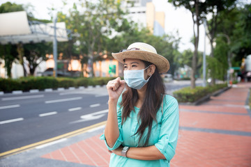 woman sick wearing face masks in the city of asia