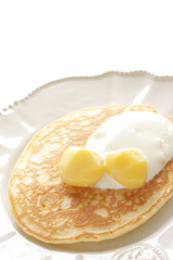 Fototapeta premium Chestnut and cream on homemade pancake with copy space