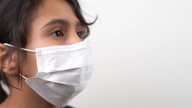 A kid with mask on quarantine for Coivid-19, corona virus.