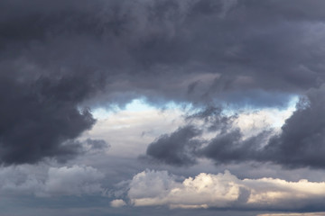 Epic dramatic Storm sky, dark grey cumulus clouds background texture