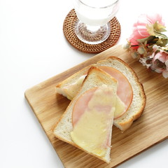 Toasted cheese and ham on English bread for comfort breakfast