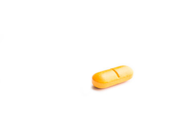 Vitamin C pill isolated on white background