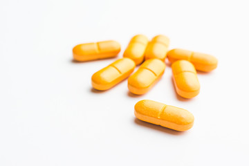 Vitamin C pills isolated on white background