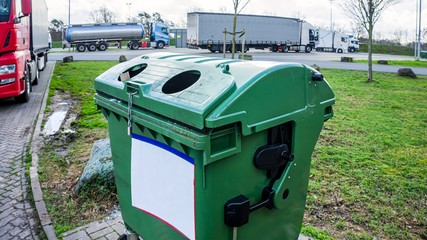 City trash cans outdoors at daytime . 