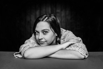 Black and White Close Up Portrait of Pretty Young Woman with Braids Smiling
