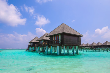 Water bungalows at the floated resort at the Maldives, small island nation in South Asia, located in the Arabian Sea.  Olhuveli Beach Spa Resort Guraidhoo. The heaven on earth with turquoise water 