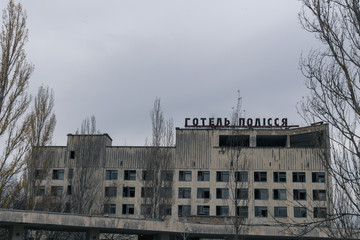 Fototapeta na wymiar The old building of the Pripyat hotel in Chernobyl