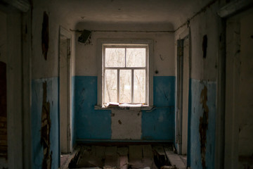 Fototapeta na wymiar Old ruined house in Pripyat in Chernobyl