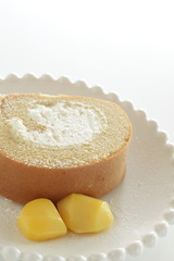 Swiss roll slice served with chestnut on white dish