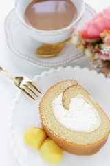 Swiss roll slice served with chestnut on white dish