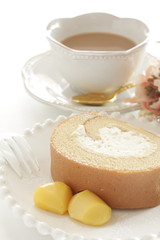 Swiss roll slice served with chestnut on white dish