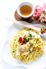 Chinese food, jiozi dumpling and noodles with chili sauce 
