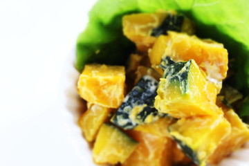 Homemade pumpkin salad in bowl with copy space