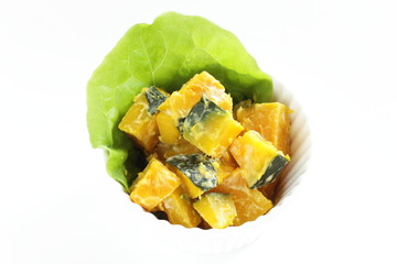 Homemade pumpkin salad in bowl with copy space