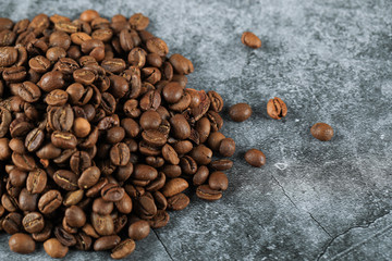 Fresh coffee beans on the left corner of the background