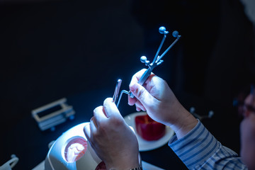 Medical students learn about brain surgery tools