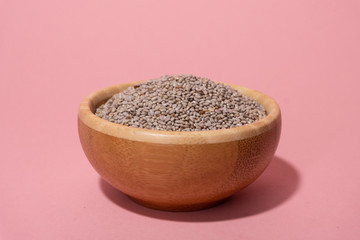 full wooden bowl of white chia seeds