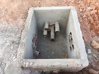 Utility services manhole under construction at the construction site. In-situ construction by...
