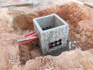 Utility services manhole under construction at the construction site. In-situ construction by...