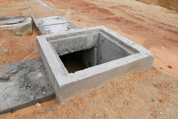 Utility services manhole under construction at the construction site. In-situ construction by workers based on infrastructure engineer design.