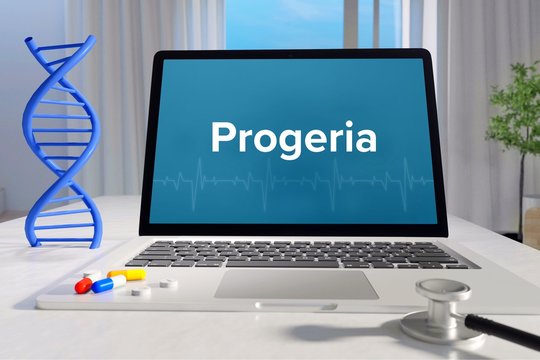 Progeria &ndash; Medizin, Gesundheit. Computer im Büro mit Begriff auf dem Bildschirm. Arzt, Krankheit, Gesundheitswesen