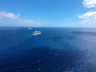 Fototapeta na wymiar Bimini, Bahamas - March 19, 2020: aerial view on the cruise ships on quarantine at the ocean at sunny weather
