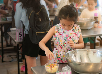 child girl feeding rabbits cooking ice cream