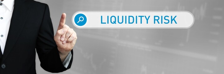 Liquidity Risk. Man in a suit points a finger at a search box. The word Liquidity Risk is in the search. Symbol for business, finance, statistics, analysis, economy