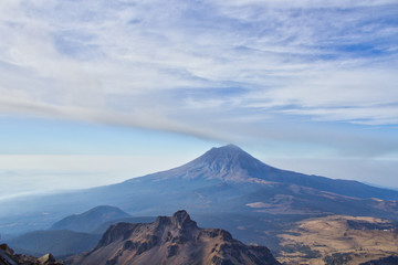 Iztaccihuatl volcano to experience the high attitude and see the active Popocatepetl