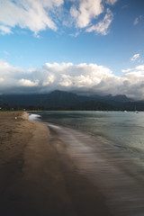 Beautiful Hawaii Beach in Kauai with Silky Waves during Warm Summer weather