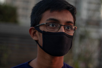 Students are wearing safety face mask and eye glass because of the reopening of schools,colleges after a long quarantine break due to the outbreak of coronavirus.Health care and hygienity 