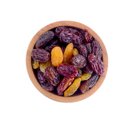 wood bowl Raisins isolated on white background.