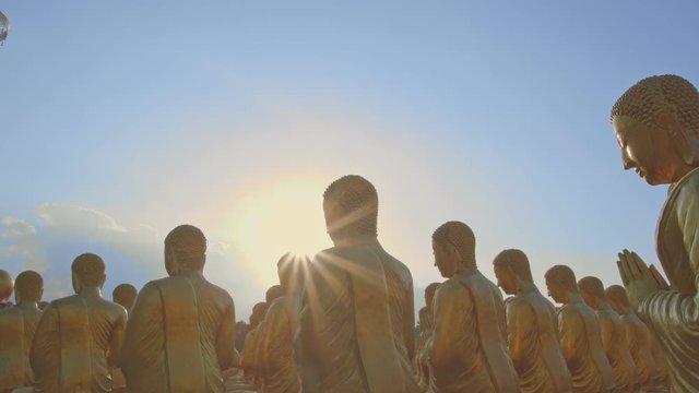 golden Buddha sculpture and disciples sculpture Makha bucha buddhist memorial park is built on the occasion of great period, buddha 2600 years at Nakornnayok province..
